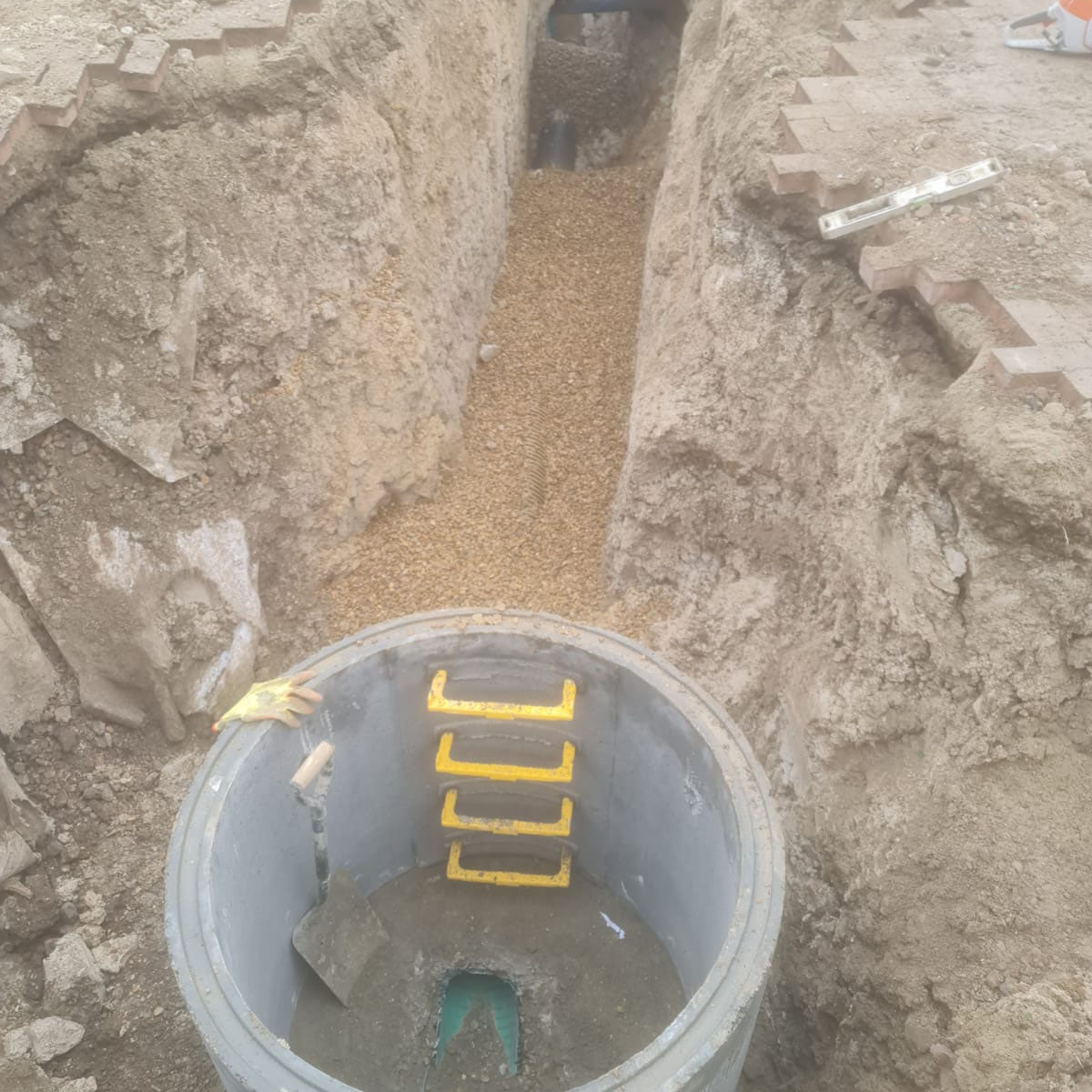 drainpipe next to excavated trench